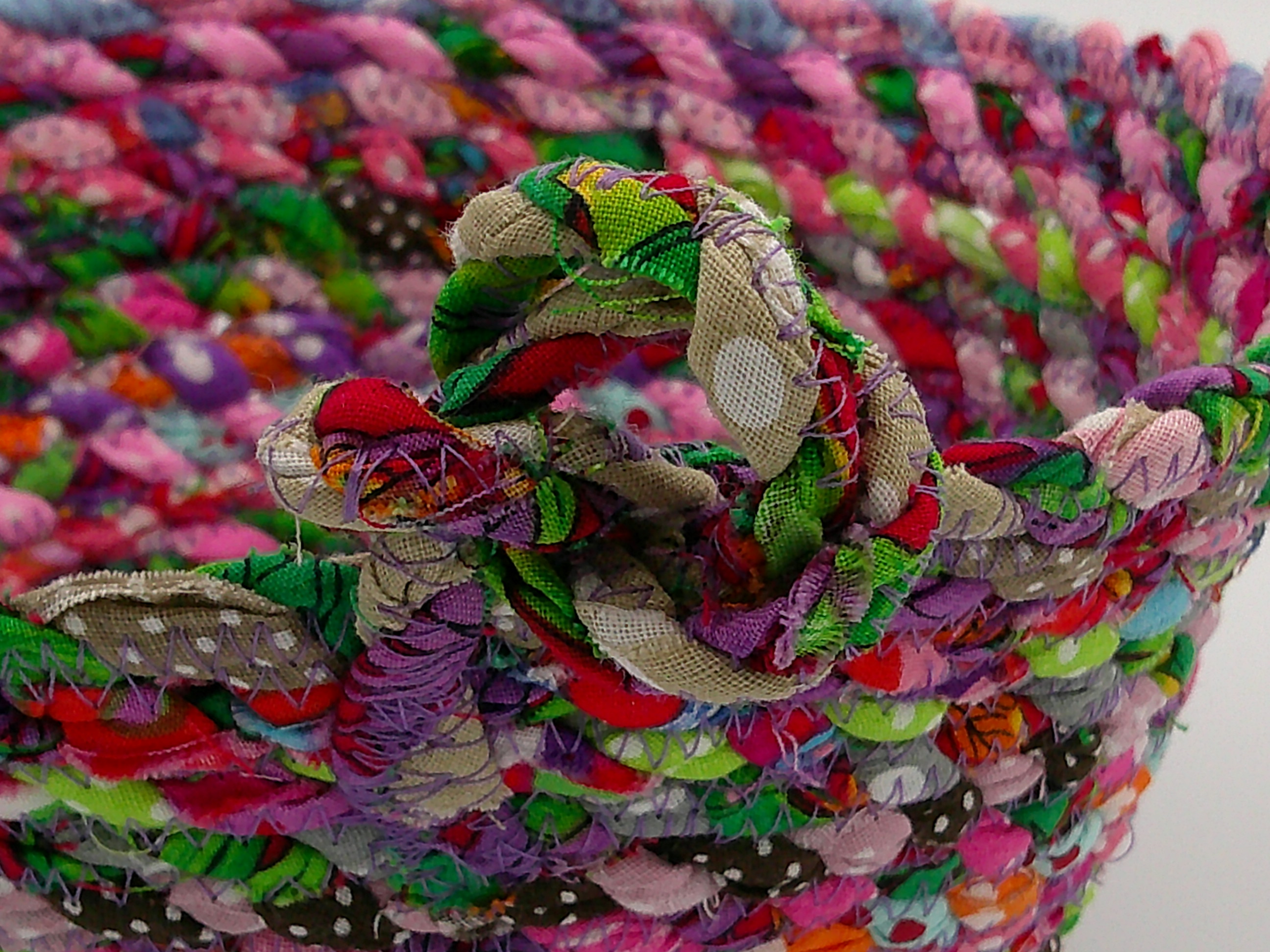 This close up of the knot gives a closer look to the rustic appeal of raw edges and errant threads. This close up of the knot gives a closer look to the rustic appeal of raw edges and errant threads.